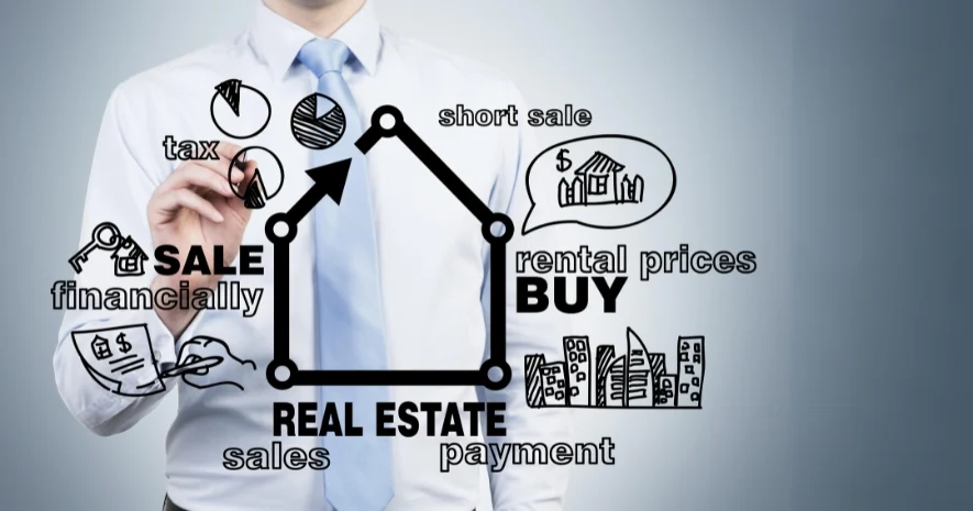 Man drawling real estate strategies on white board